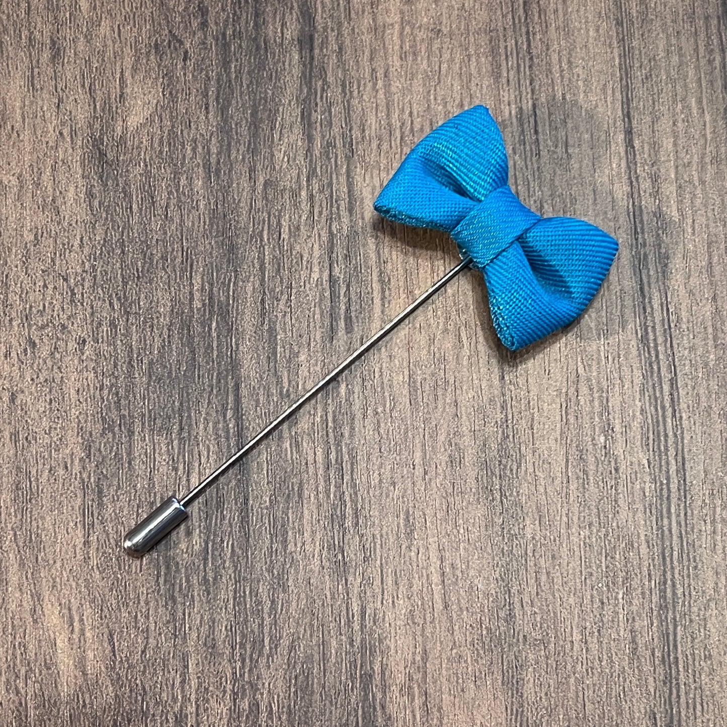 Tasker & Shaw | Luxury Menswear | Electric blue bow tie lapel pin