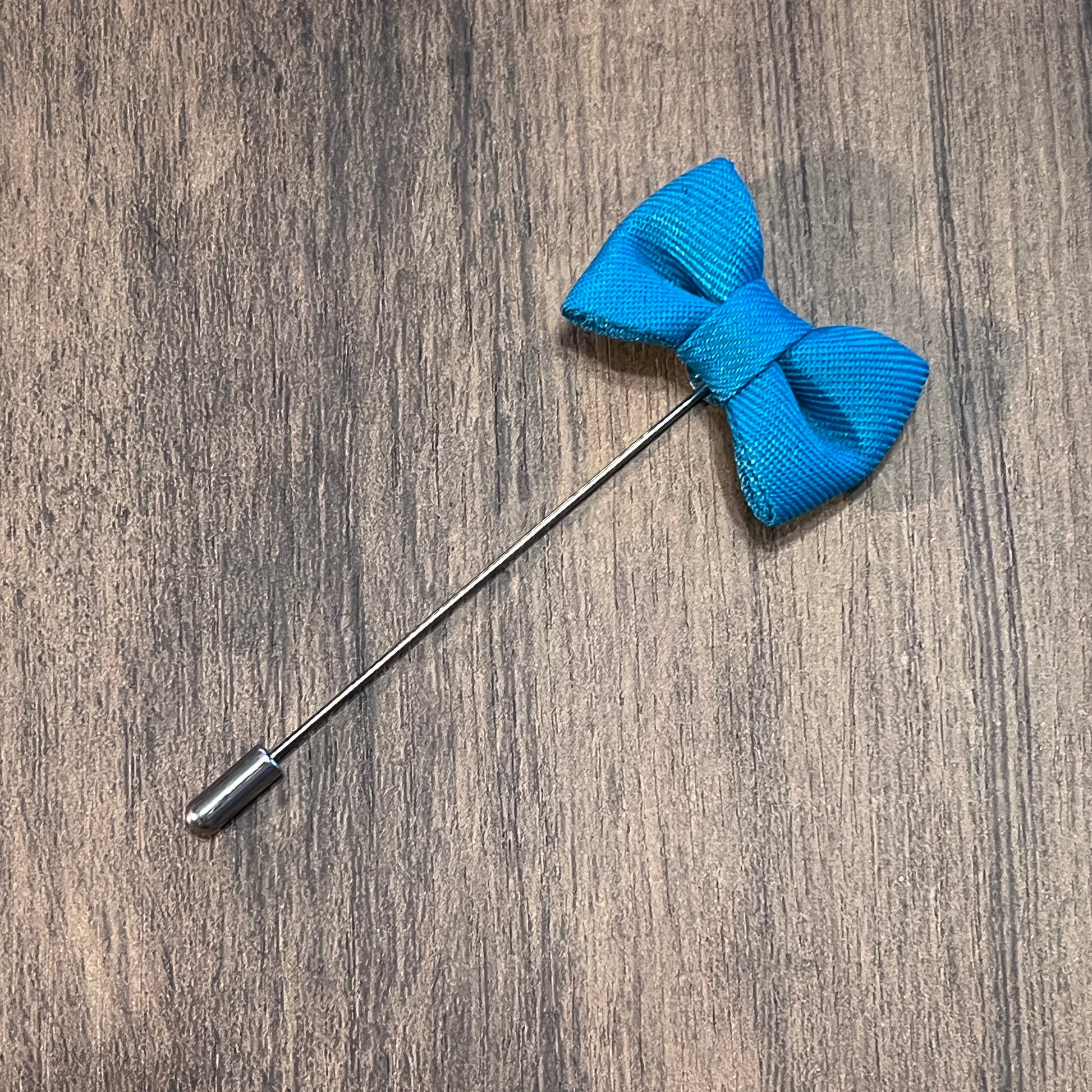 Tasker & Shaw | Luxury Menswear | Electric blue bow tie lapel pin