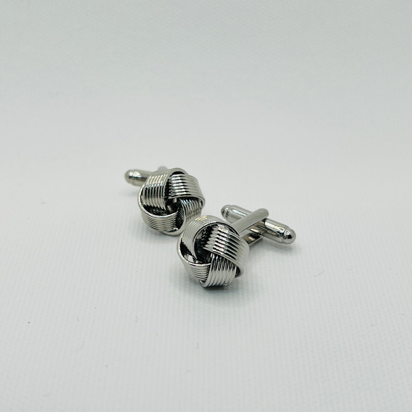 Tasker & Shaw | Luxury Menswear | Silver ribbon knot cufflinks